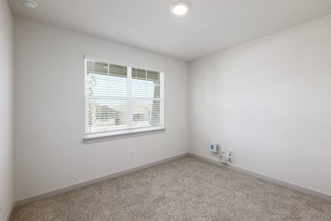 Spare room with carpet flooring and a smoke detector | Image 17