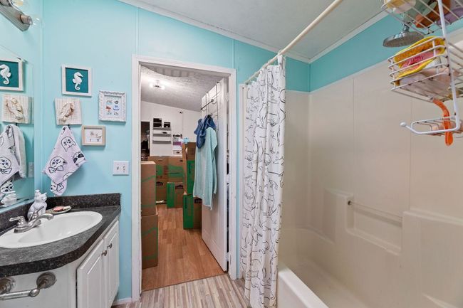 Jack & Jill bathroom with vanity, a shower / bath combination between 2nd & 3rd bedroom | Image 13