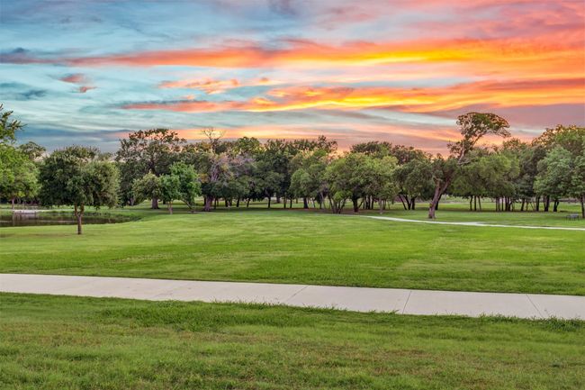 Twilight view of the park across the street. Great for sitting out on the front lawn, visiting with neighbors and people-watching those strolling by in the park. | Image 37