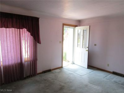 View of carpeted entrance foyer | Image 2