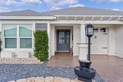 INVITING ENTRANCE WITH LOVELY CUSTOM DESIGN LEADED GLASS FRONT DOOR AND SIDELITE. | Image 2