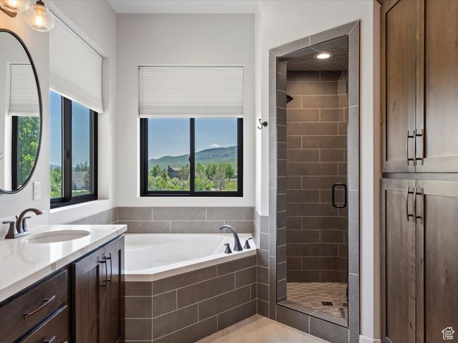 Full bathroom with vanity, a shower stall, and a garden tub | Image 28