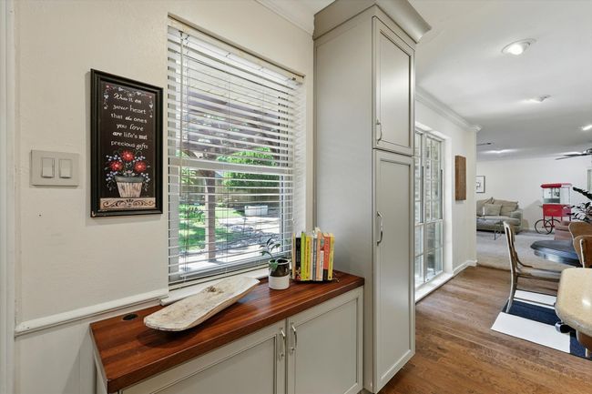 Hall with dark wood-style flooring and ornamental molding | Image 12