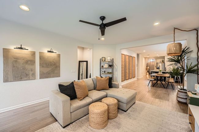 Living area featuring recessed lighting, light wood-style flooring, baseboards, and a ceiling fan | Image 9