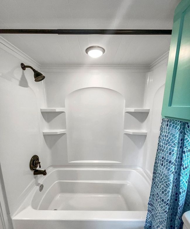 Full bathroom featuring shower / tub combo with curtain and crown molding | Image 29