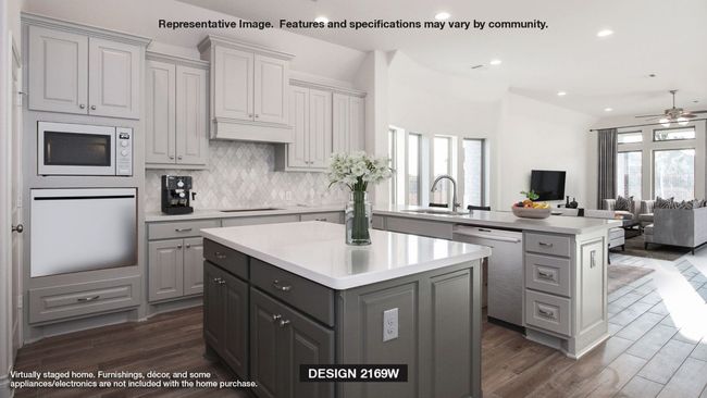 Kitchen with wall oven, gray cabinetry, a center island, dishwasher, and a sink | Image 5