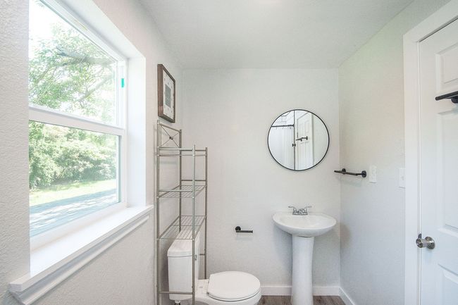 2nd story Bathroom with toilet and a sink | Image 23