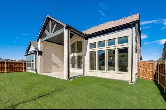 Rear view of property with brick siding and a patio area | Image 21
