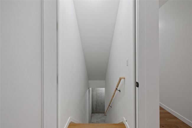 Stairway featuring wood finished floors and baseboards | Image 33