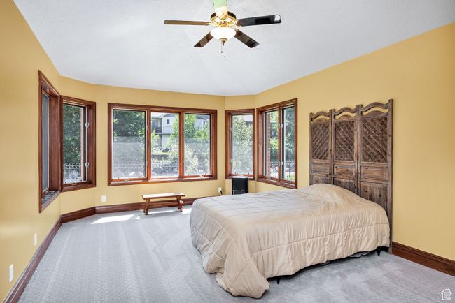 Carpeted bedroom featuring baseboards and a ceiling fan | Image 48