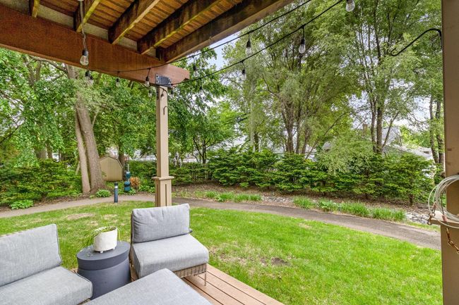 Awesome main level covered deck just with easy access to greenspace and walking paths | Image 9