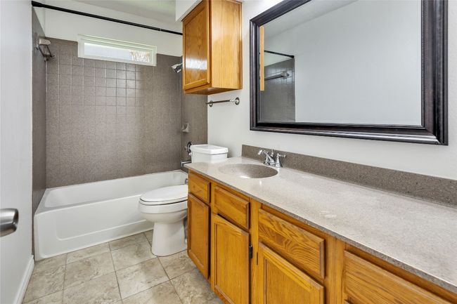 Bathroom featuring shower combination, vanity, and tile patterned flooring | Image 10