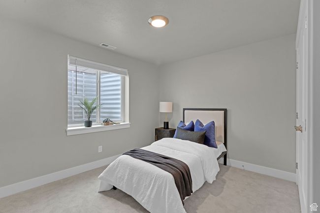 Bedroom with carpet flooring and baseboards | Image 13