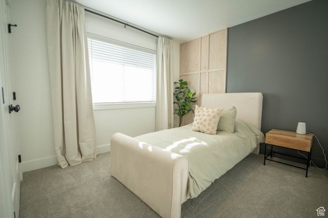 This cozy bedroom #2 features a stunning design with a 1/3 light wood accent wall, perfectly paired with a bold Iron Ore backdrop. The combo creates a relaxing, peaceful vibe that feels both modern and serene. | Image 20