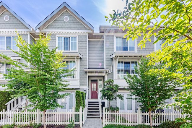 View of front of home with a fenced front yard | Image 36