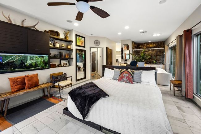 primary first level bedroom with marble floors | Image 28