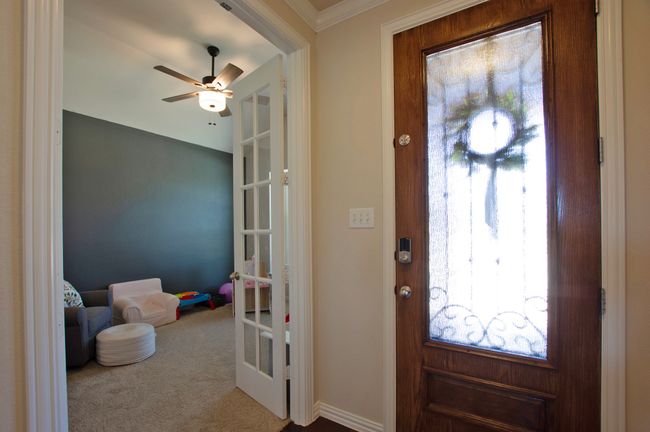 Foyer entrance featuring ornamental molding, carpet, and a ceiling fan | Image 4