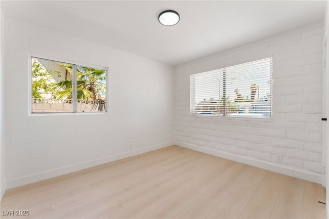 Unfurnished room featuring light wood finished floors and healthy amount of natural light | Image 37