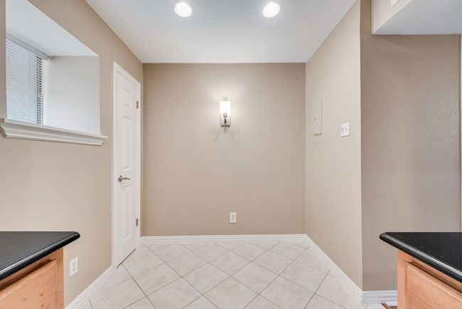 Unfurnished dining area with light tile patterned floors, baseboards, and recessed lighting | Image 15