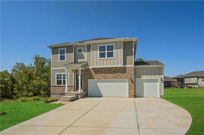 View of front of home with a front yard and a garage | Image 3