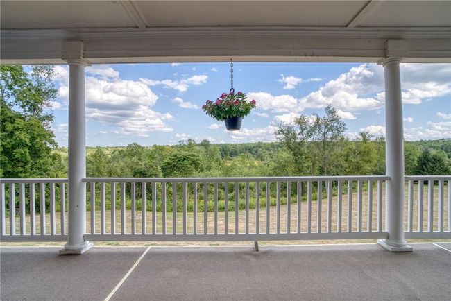 View of patio with a balcony | Image 5