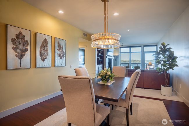 A gorgeous chandelier adorns the formal dining room. | Image 6