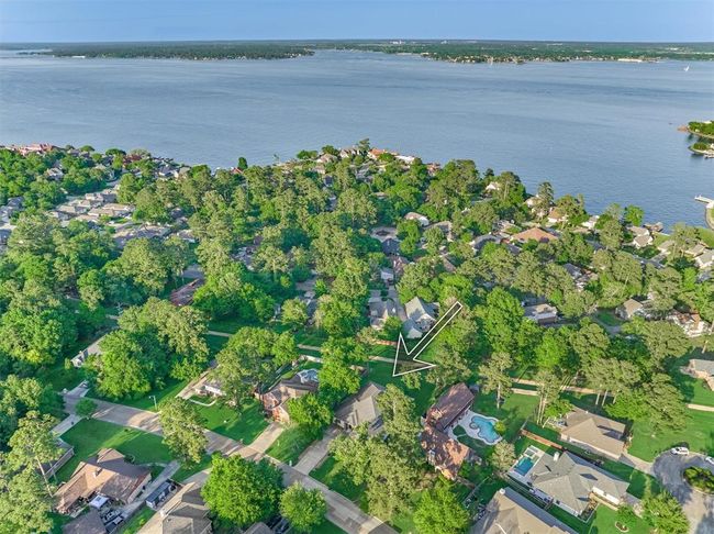 Located just a few blocks from the shores of Lake Conroe, this home offers convenient access to lakeside living. Residents of Walden enjoy exclusive amenities, including two private boat ramps for easy and direct lake access. | Image 4