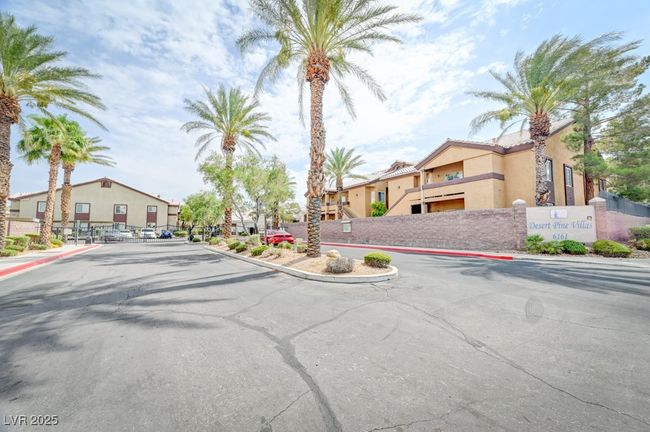 View of asphalt street featuring a residential view, curbs, and sidewalks | Image 25