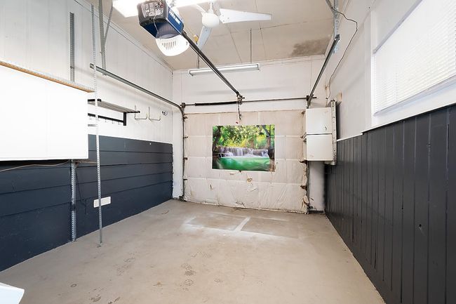 Garage with a garage door opener | Image 24