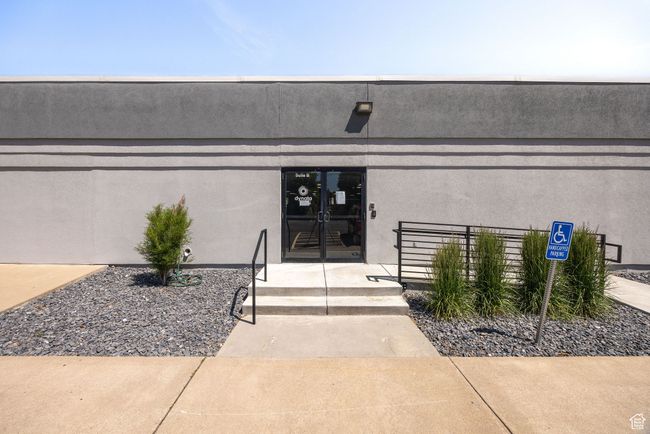 Entrance to property with stucco siding and french doors | Image 25