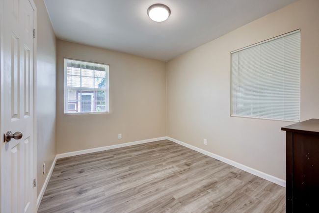 Unfurnished room with baseboards and wood finished floors | Image 7