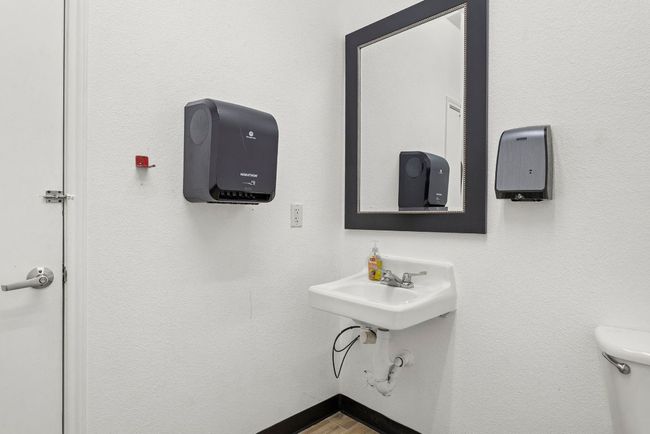 Bathroom with toilet and wood finished floors | Image 29