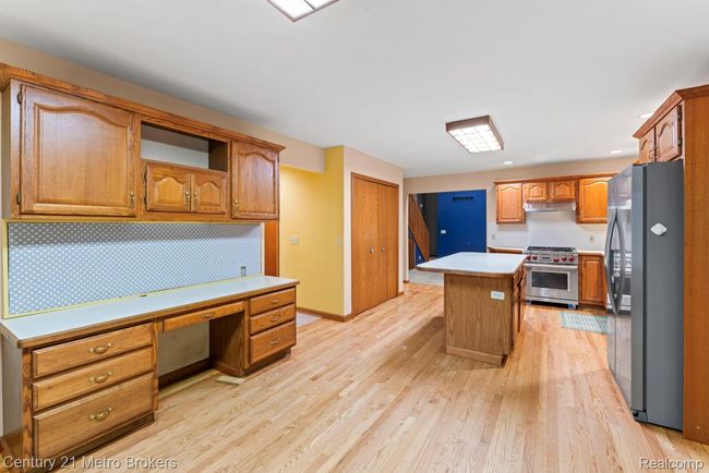 Kitchen with built in desk and eating area | Image 7