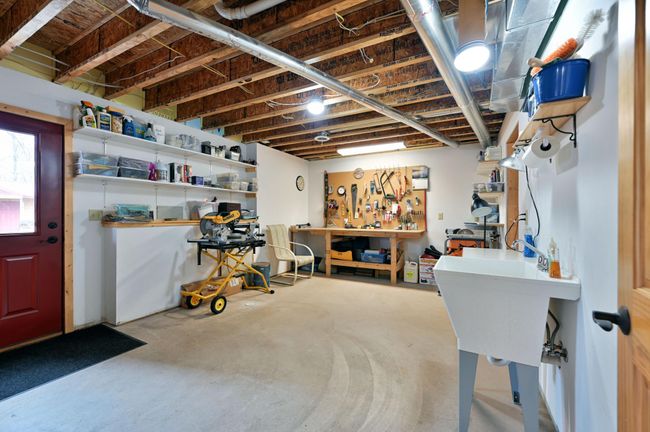 Lower level workshop with sink. | Image 56