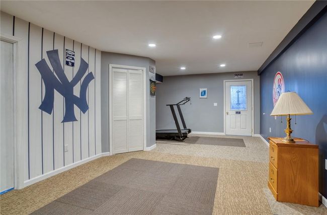 A room for recreation with carpeted floors | Image 28