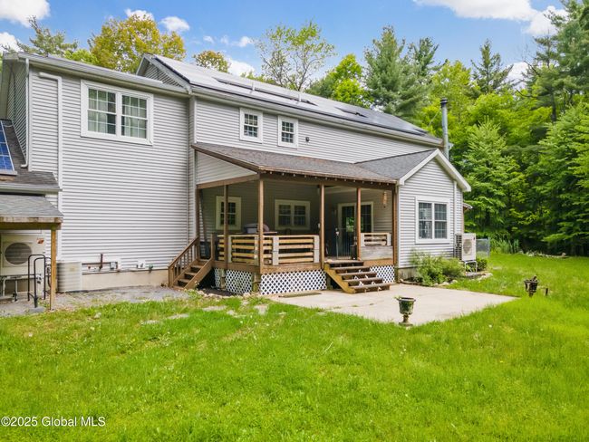 Exterior Features of House include invisible dog fence, whole house generator, newer covered gutter system, 375 ft drilled well, car port, 2 sheds, 2 decks | Image 43