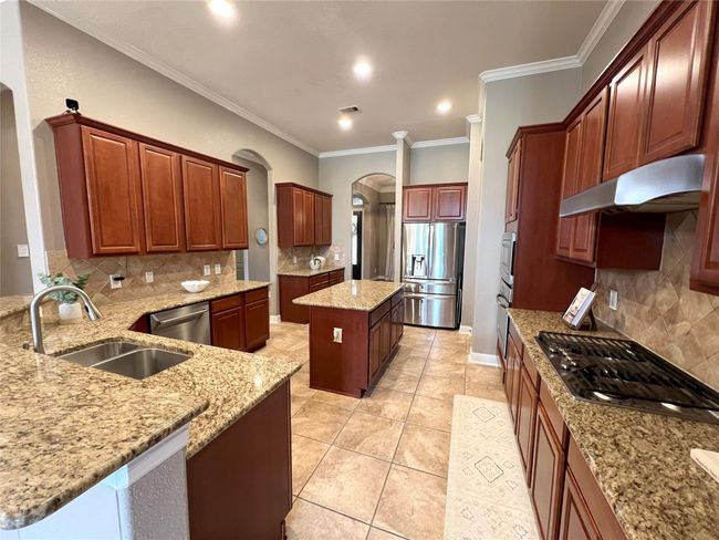 Look at the counterspace this kitchen offers! Stainless still appliances and built in microwave. | Image 7