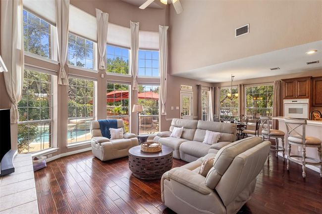 View of the family room standing outside of the primary bedroom. | Image 13
