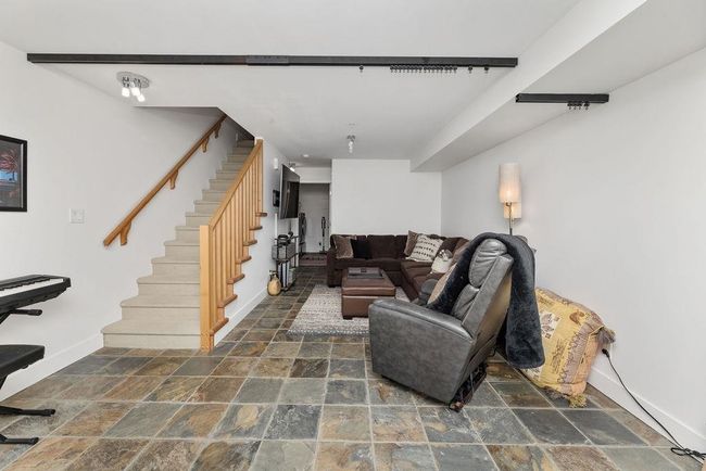 Downstairs recreation area/family room that could be converted to a third bedroom or used as a home business with separate entry | Image 27