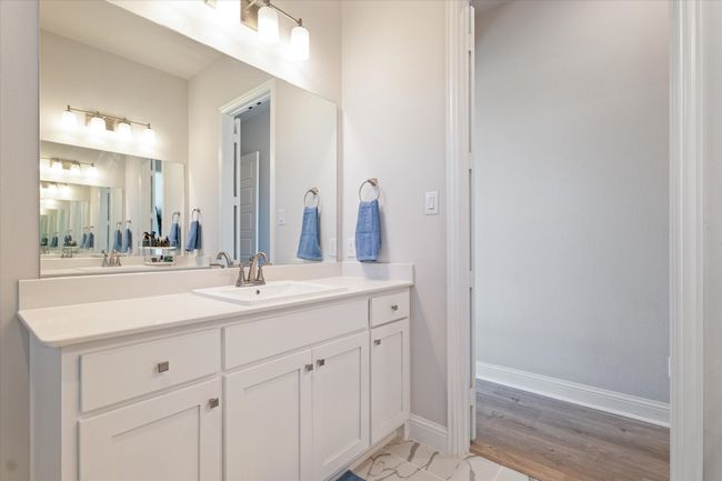 Bathroom featuring vanity, wood finished floors, and baseboards | Image 23