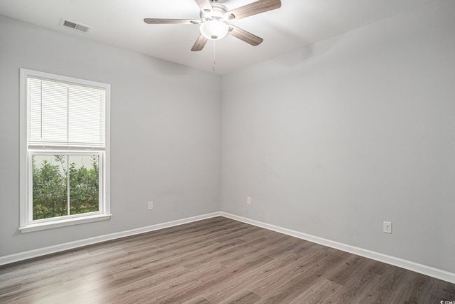 Spare room with wood finished floors and ceiling fan | Image 21