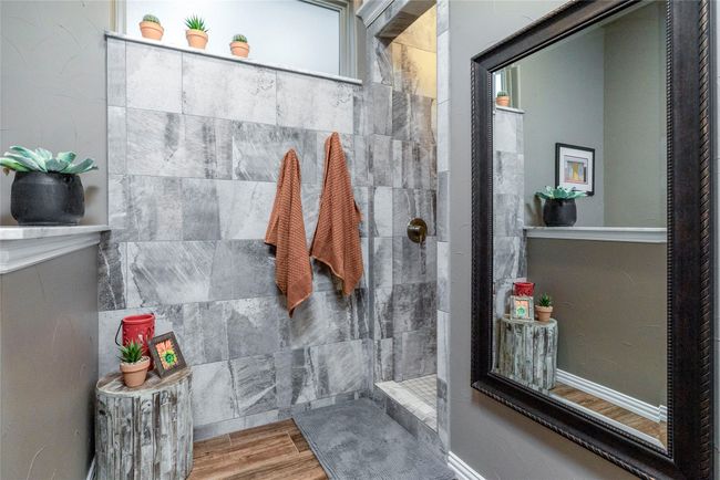 Full bath with wood-like tile floors and a large walk in shower | Image 23