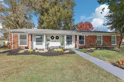 Ranch-style home featuring a porch and a front yard | Image 3