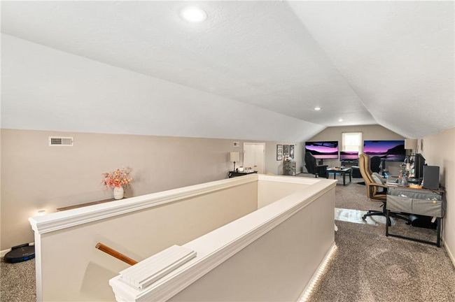 Office space with vaulted ceiling and carpet | Image 39