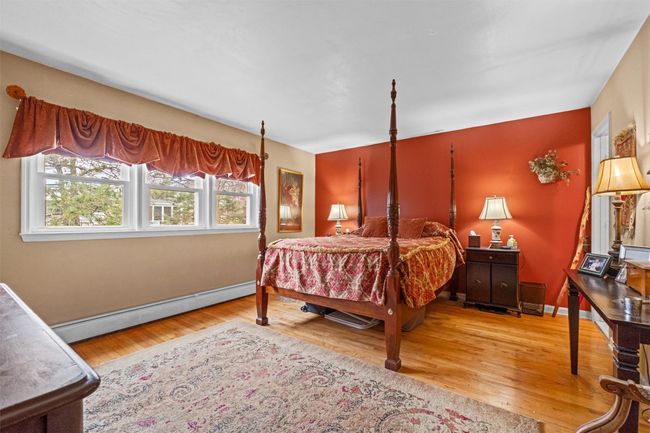 Primary Bedroom with hardwood floors, walk-in closet and bathroom | Image 19