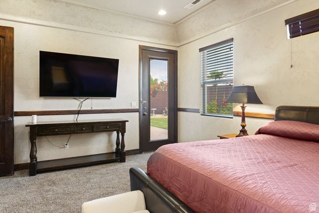 Carpeted bedroom with access to exterior | Image 26