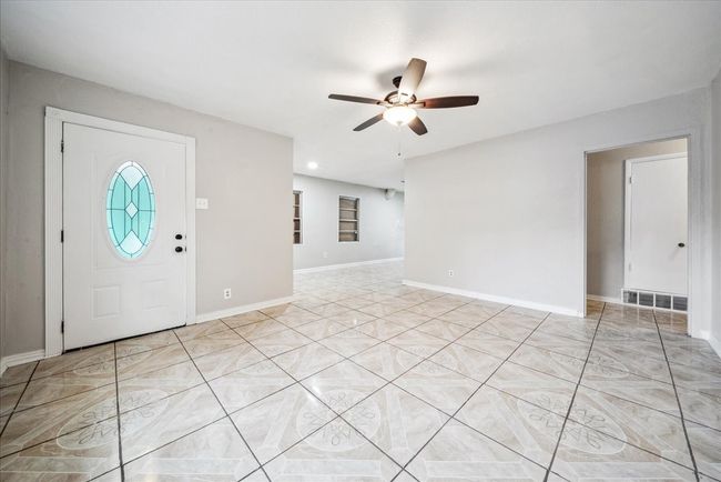 Entrance foyer featuring ceiling fan and baseboards | Image 7