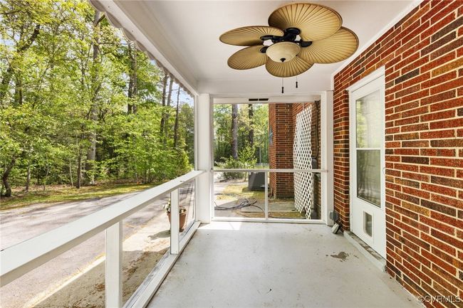 Unfurnished sunroom featuring ceiling fan | Image 25