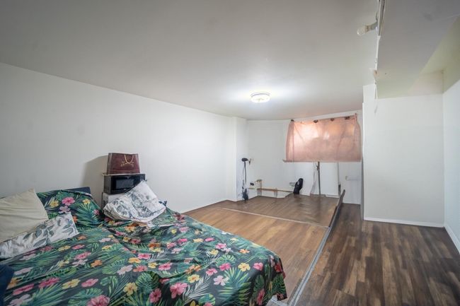 Bedroom with wood finished floors | Image 22