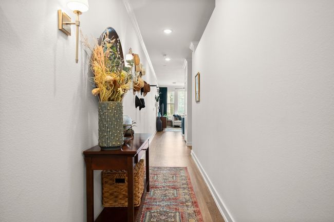 Laminate style wood look floors and crisp white paint | Image 4